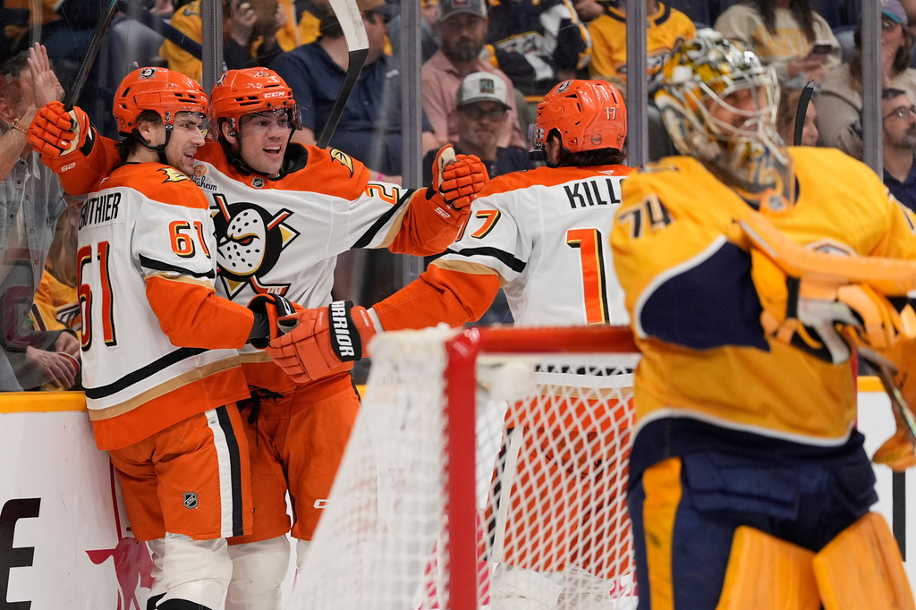 Anaheim Ducks left wing Cutter Gauthier (61) celebrates his goal with center Ryan Poehling (25) and left wing Alex Killorn (17) during the first period of an NHL hockey game against the Nashville Predators, Thursday, April 16, 2026, in Nashville, Tenn. (AP Photo/George Walker IV)