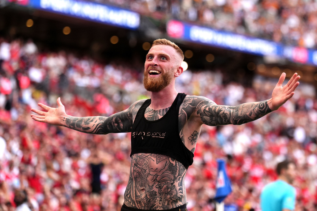 Hull City's Oliver McBurnie celebrates scoring their side's first goal of the game during the Championship play-off final between Hull City and Middlesbrough at Wembley Stadium, London, Saturday May 23, 2026. (John Walton/PA via AP)