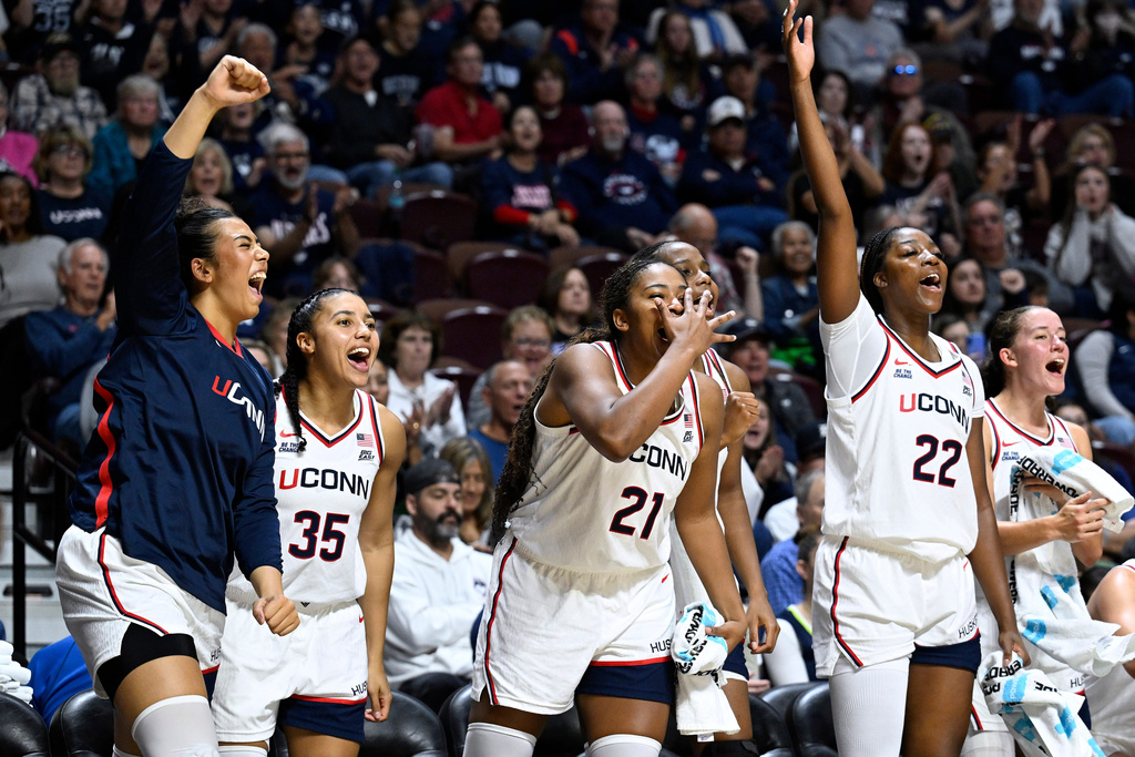From left to right, UConn's Jana el Alfy, Azzi Fudd, Sarah Strong, and Serah Williams react in the second half of an exhibition NCAA college basketball game against Boston College, Monday, Oct. 13, 2025, in Uncasville, Conn. (AP Photo/Jessica Hill)