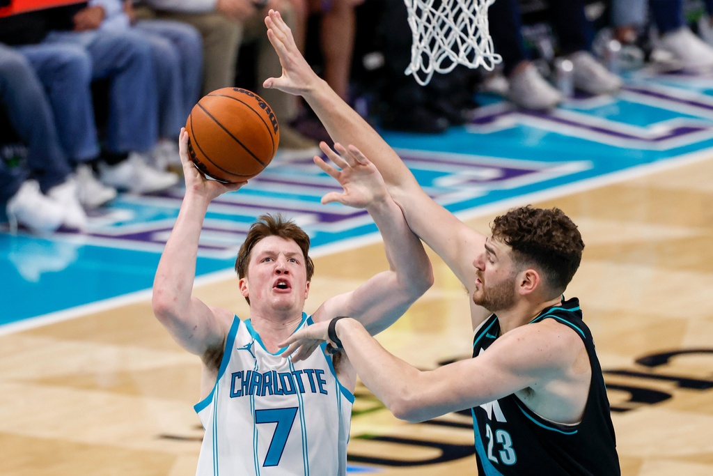 Charlotte Hornets guard Kon Knueppel (7) shoots against Portland Trail Blazers center Donovan Clingan during the second half of an NBA basketball game in Charlotte, N.C., Saturday, Feb. 28, 2026. (AP Photo/Nell Redmond)