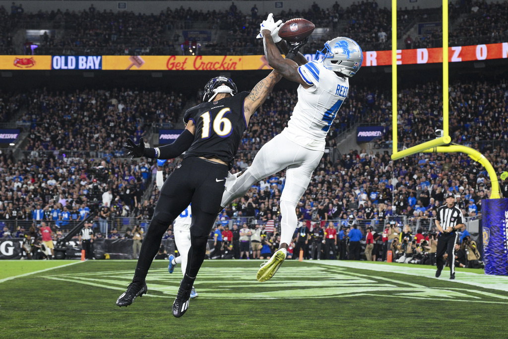 Detroit Lions cornerback DJ. Reed (4) breaks up a pass intended for Baltimore Ravens wide receiver Tylan Wallace (16) during the second half of an NFL football game Monday, Sept. 22, 2025, in Baltimore. (AP Photo/Nick Wass)