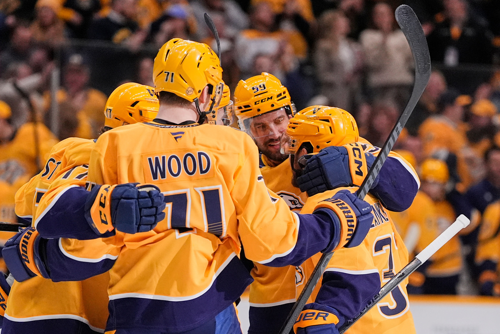 Nashville Predators defenseman Roman Josi (59) celebrates his goal with teammates during the second period of an NHL hockey game against the Edmonton Oilers, Tuesday, Jan. 13, 2026, in Nashville, Tenn. (AP Photo/George Walker IV)