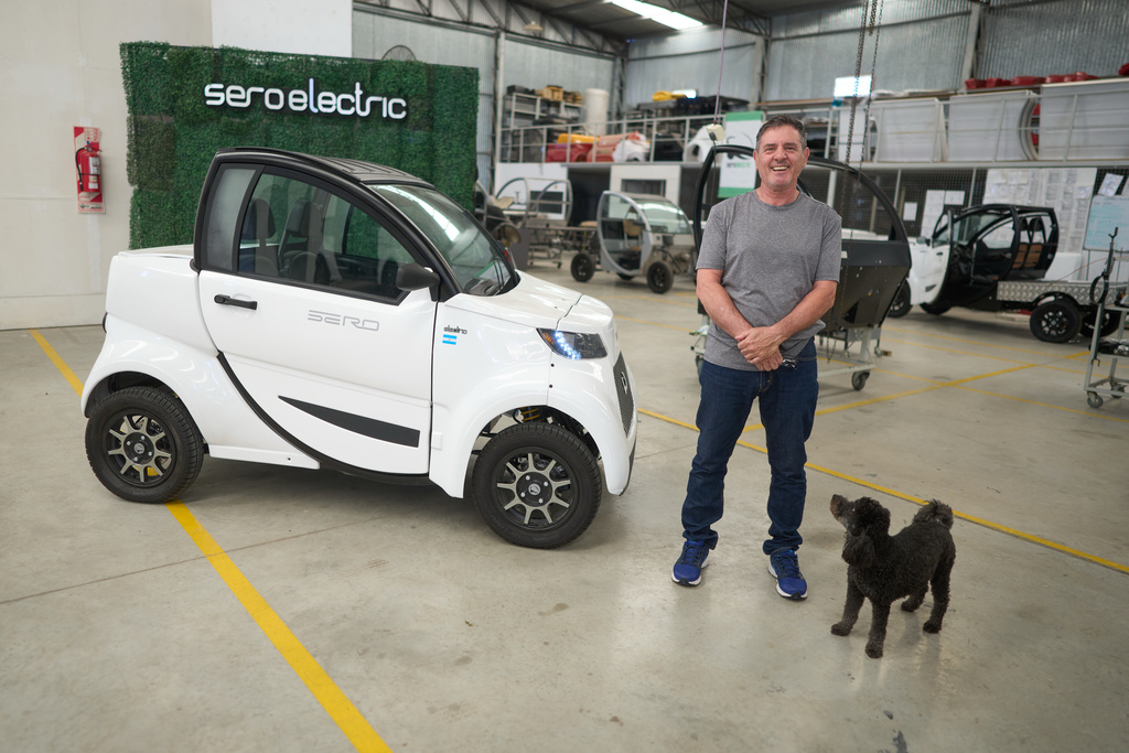 Pablo Naya, the owner of Sero Electric, poses next to one of the company's electric microcars at its factory in Castelar, Argentina, Wednesday, Jan. 21, 2026. (AP Photo/Victor R. Caivano)