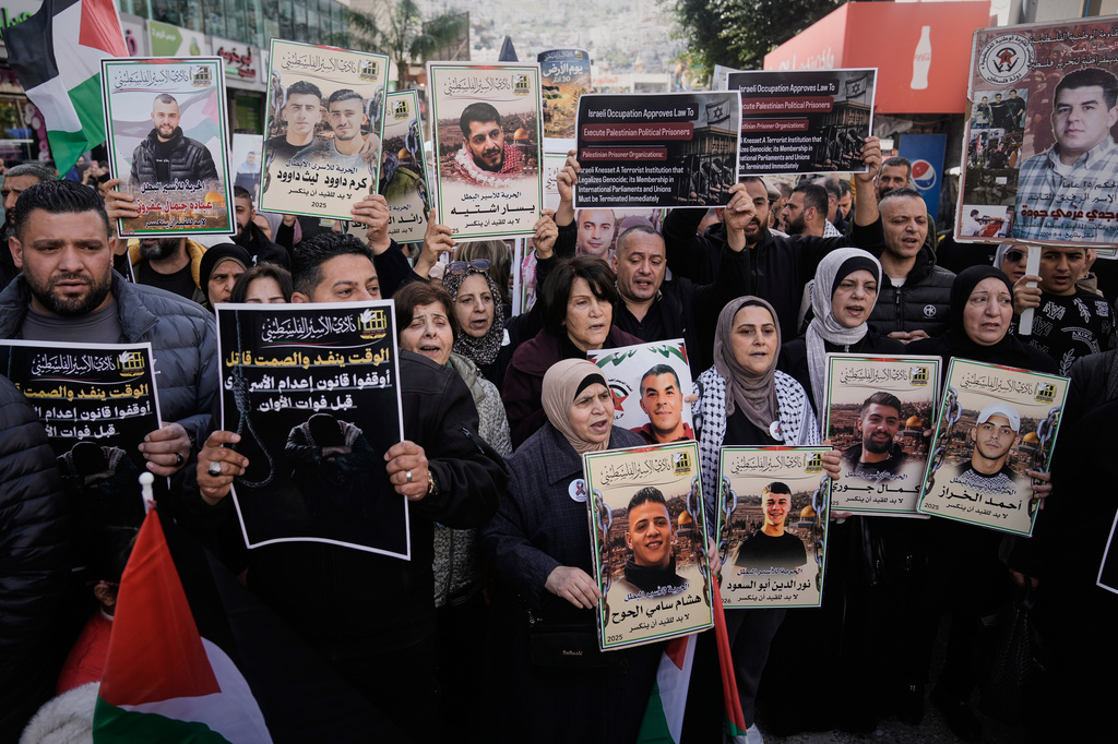 Palestinians demonstrate against the decision by Israel's parliament to approve the death penalty for Palestinians convicted of murdering Israelis in Nablus, West Bank, Tuesday, March 31, 2026. (AP Photo/Majdi Mohammed)