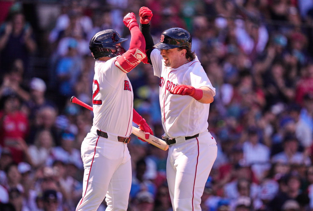 Boston Red Sox's Adley Rutschman, right, is congratulated by Wilyer Abreu after his three-run home run during the second inning of a baseball game against the Los Angeles Angels, Monday, Sept. 7, 2026, in Boston. (AP Photo/Charles Krupa)