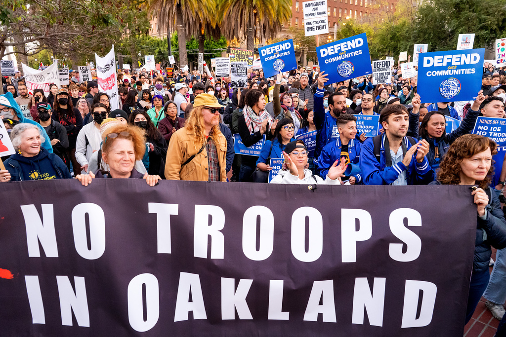 Protesters rally against immigration raids in San Francisco on Thursday, Oct. 23, 2025. (AP Photo/Noah Berger)