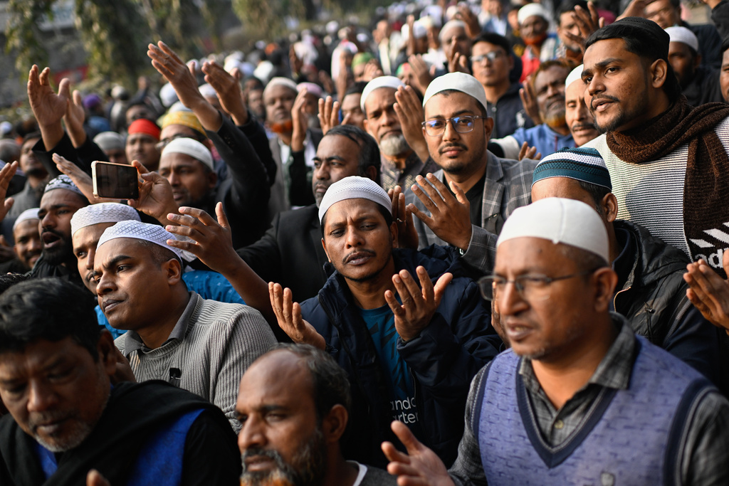 People react during funeral prayers for former Prime Minister Khaleda Zia outside the national Parliament building in Dhaka, Bangladesh, Wednesday, Dec. 31, 2025. (AP Photo/Mahmud Hossain Opu)