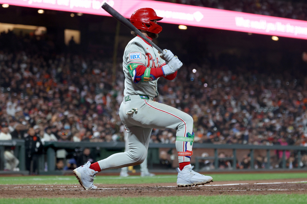 Philadelphia Phillies' Bryce Harper watches his two-run single against the San Francisco Giants during the seventh inning of a baseball game in San Francisco, Monday, April 6, 2026. (AP Photo/Jed Jacobsohn)