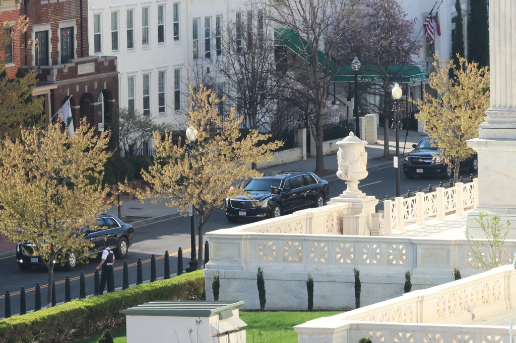 President Donald Trump's motorcade arrives at the U.S. Supreme Court, Wednesday, April 1, 2026, in Washington. (AP Photo/Tom Brenner)