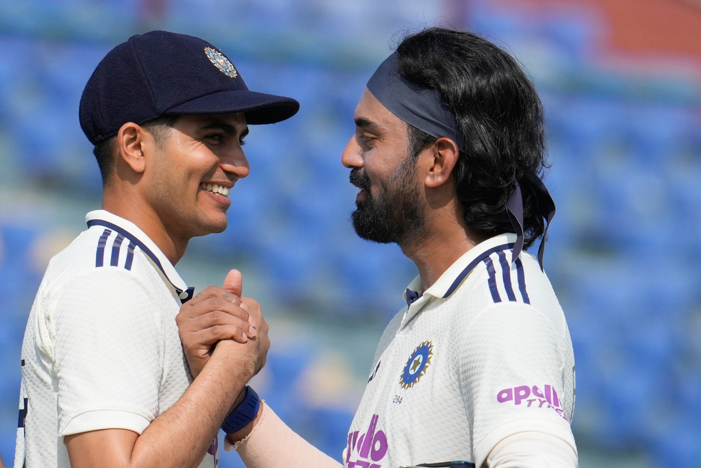 India's captain Shubman Gill congratulates teammate KL Rahul on wining the second cricket test match between India and West Indies at the Arun Jaitley Stadium in New Delhi, India, Tuesday, Oct.14, 2025. (AP Photo/Manish Swarup)