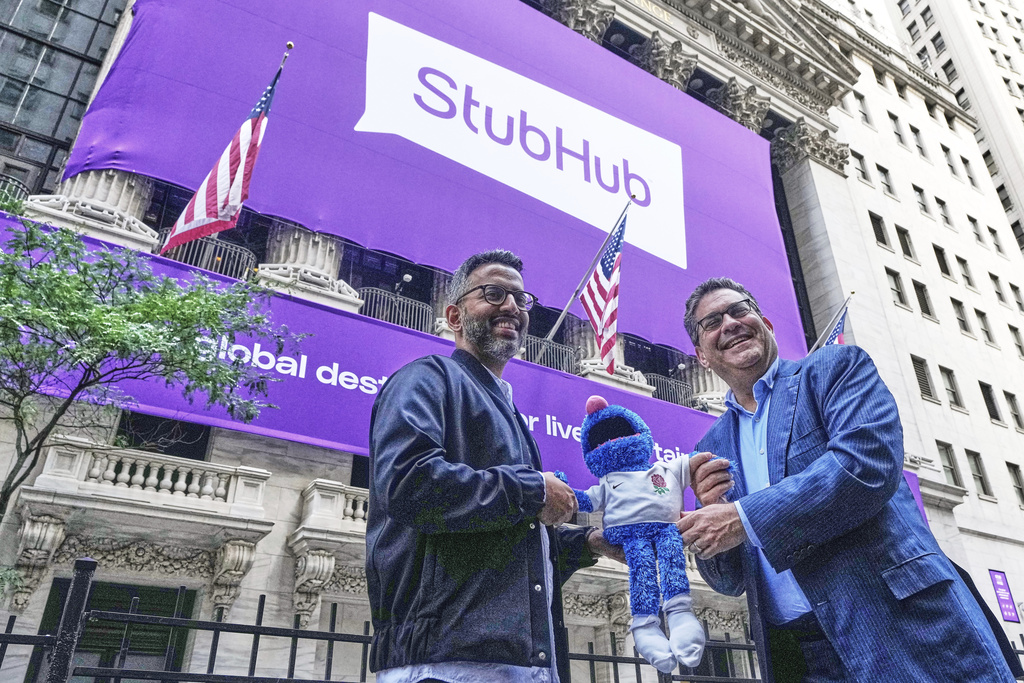 StubHub President Nayaab Islam, left, and CEO Eric Baker pose for photos outside the New York Stock Exchange before the company's IPO, Wednesday, Sept. 17, 2025. (AP Photo/Richard Drew)