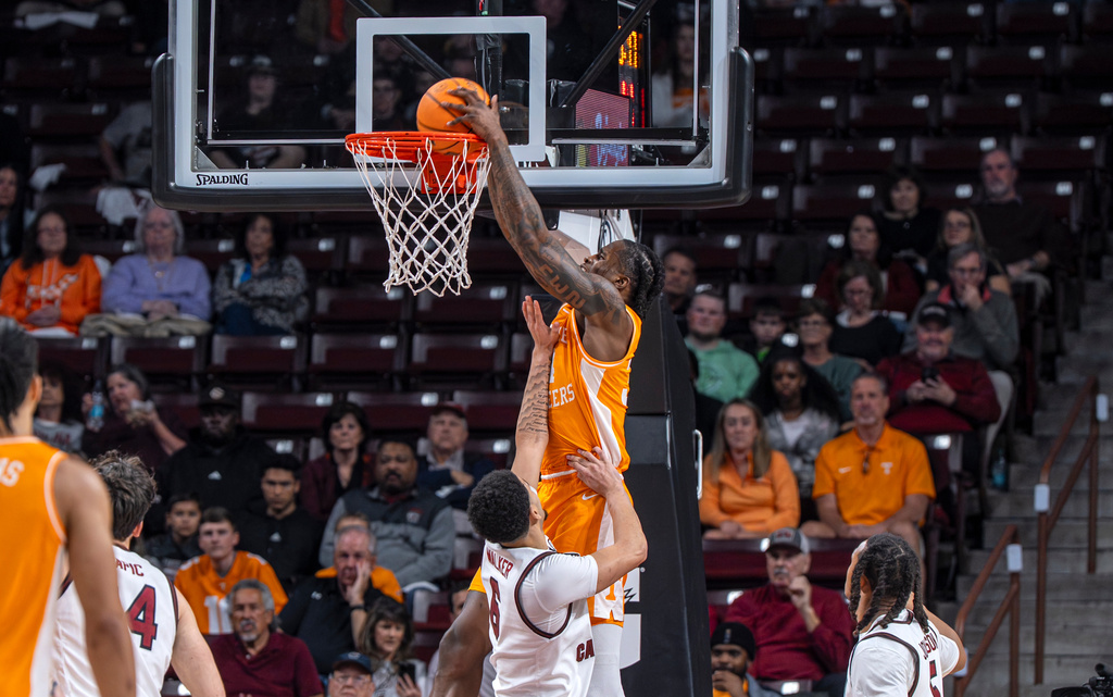 Tennessee center Felix Okpara (34) dunks the ball over South Carolina forward EJ Walker (6) during the first half of an NCAA college basketball game Tuesday, March 3, 2026, in Columbia, S.C. (AP Photo/David Yeazell)