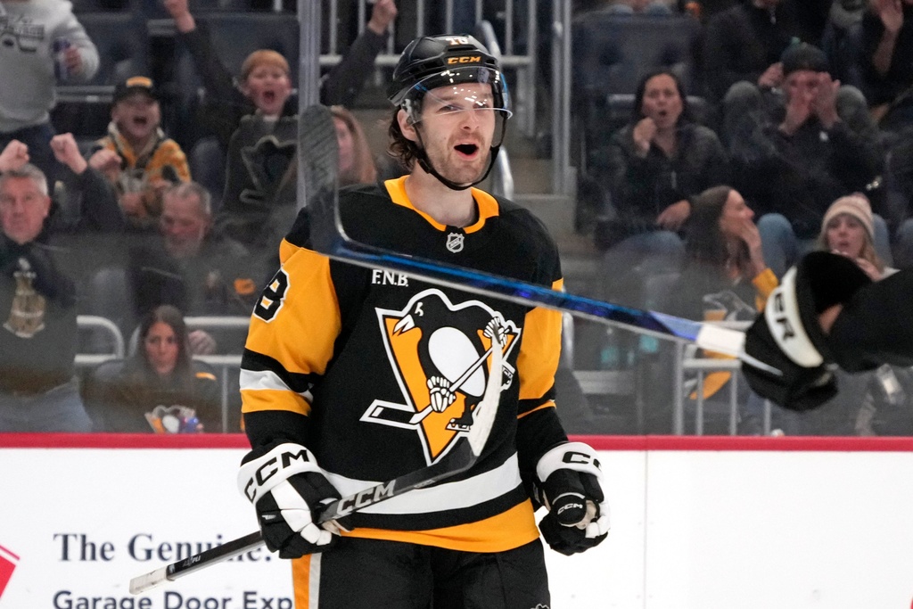 Pittsburgh Penguins' Tommy Novak celebrates his goal during the second period of an NHL hockey game against the Vancouver Canucks in Pittsburgh, Tuesday, Oct. 21, 2025. (AP Photo/Gene J. Puskar)