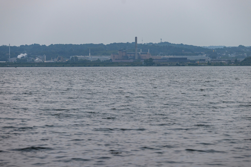 FILE - Industrial buildings sit on the shores of Onondaga Lake, Thursday, Aug. 3, 2023, in Syracuse, N.Y. (AP Photo/Lauren Petracca, File)