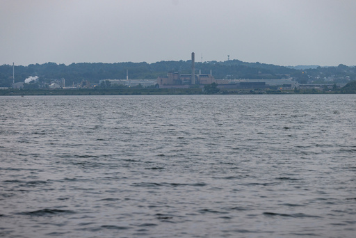 FILE - Industrial buildings sit on the shores of Onondaga Lake, Thursday, Aug. 3, 2023, in Syracuse, N.Y. (AP Photo/Lauren Petracca, File) FILE - Industrial buildings sit on the shores of Onondaga Lake, Thursday, Aug. 3, 2023, in Syracuse, N.Y. (AP Photo/Lauren Petracca, File)