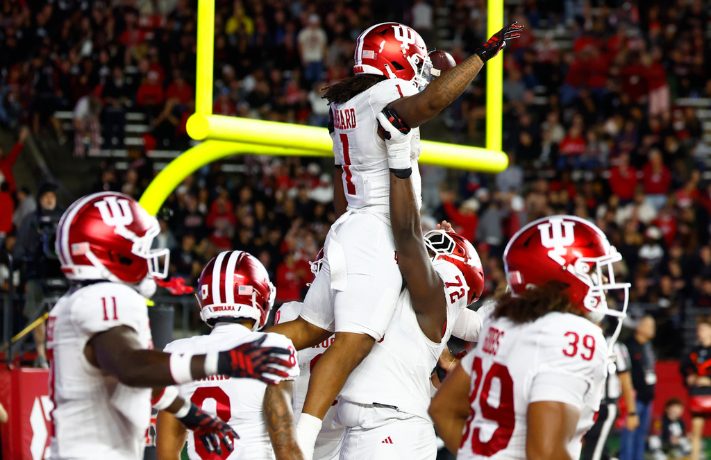 Indiana running back Turbo Richard (1) celebrates with teammates after scoring a touchdown against Rutgers during the first half of an NCAA college football game, Saturday, Oct. 3, 2026, in Piscataway, N.J. (AP Photo/Noah K. Murray)