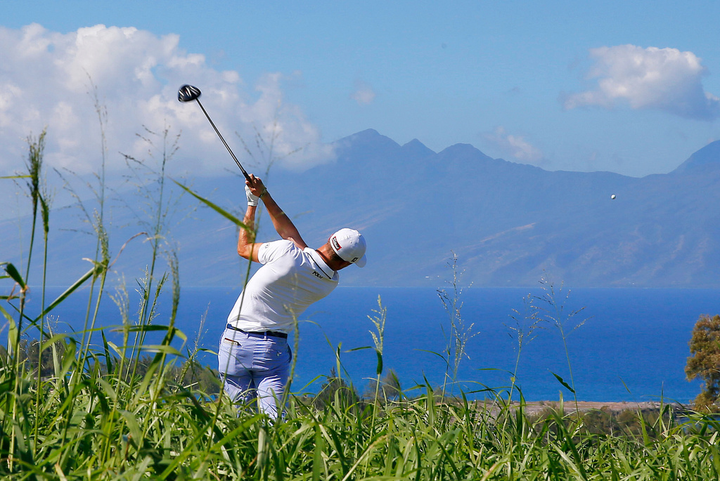 FILE - Justin Thomas hits from the seventh tee during the first round of the Tournament of Champions golf tournament at Kapalua Plantation Course on Kapalua, Hawaii, Jan. 7, 2016. (AP Photo/Matt York, File)