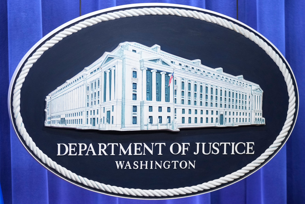 The Department of Justice seal is seen at the Justice Department, Wednesday, Nov. 19, 2025, in Washington. (AP Photo/Mark Schiefelbein)