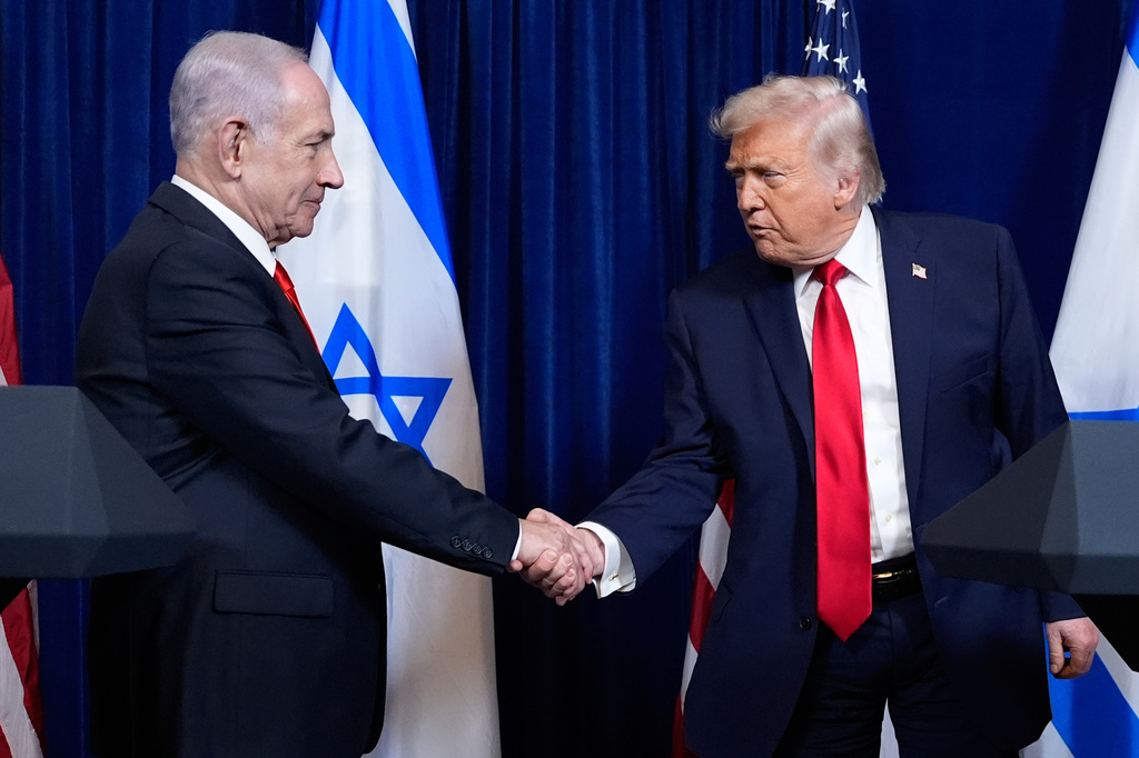 President Donald Trump shakes hands with Israel's Prime Minister Benjamin Netanyahu at the end of a news conference at Mar-a-Lago, Dec. 29, 2025, in Palm Beach, Fla. (AP Photo/Alex Brandon, File)