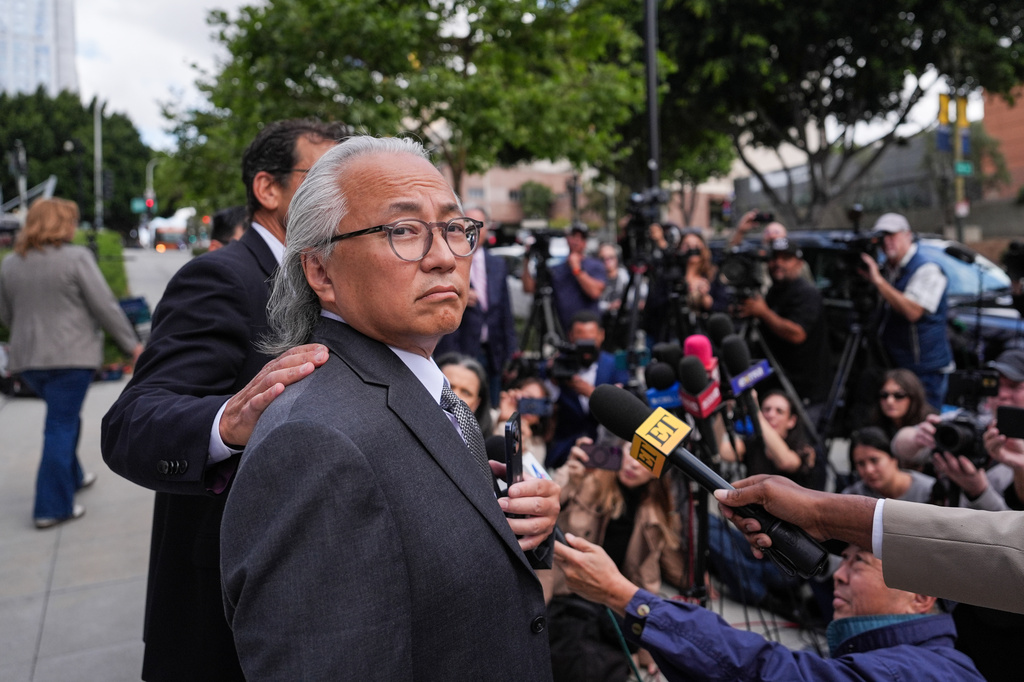 Kenneth Iwamasa, one of five people who pleaded guilty in the ketamine overdose death of actor Matthew Perry, looks away as his attorney, Alan Eisner, talks to reporters after Iwamasa's sentencing in Los Angeles, Wednesday, May 27, 2026. (AP Photo/Jae C. Hong)