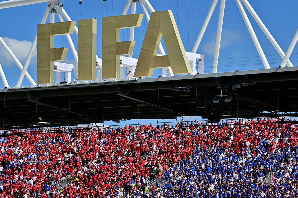 Fans of both teams cheer under a FIFA sign in the stands during the World Cup Group B soccer match between Canada and Bosnia, Friday, June 12, 2026, in Toronto. (Sammy Kogan/The Canadian Press via AP)