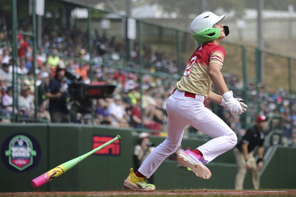 Las Vegas, Nev.'s Ethan Robertson watches his hit as he runs to first against Bonney Lake, Wash., during the first inning of a baseball game at the Little League World Series, Friday, Aug. 15, 2025, in South Williamsport, Pa. (AP Photo/Jared Freed)