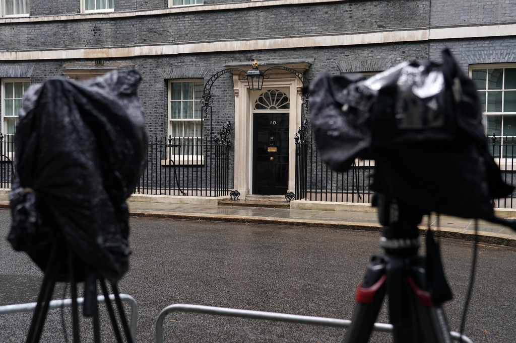 Cameras are covered with rain covers as journalists wait for a showing of Britain's Prime Minister Keir Starmer at 10 Downing Street in London, Monday, May 11, 2026.(AP Photo/Alberto Pezzali)