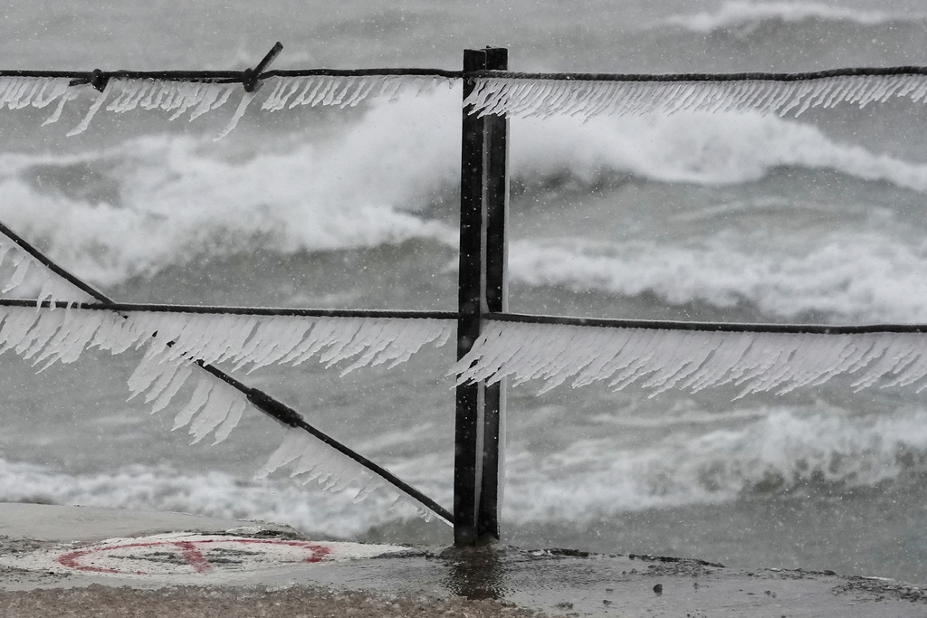 Icicles form along a pier at Loyola Beach, Saturday, Nov. 29, 2025, in Chicago. (AP Photo/Kiichiro Sato)