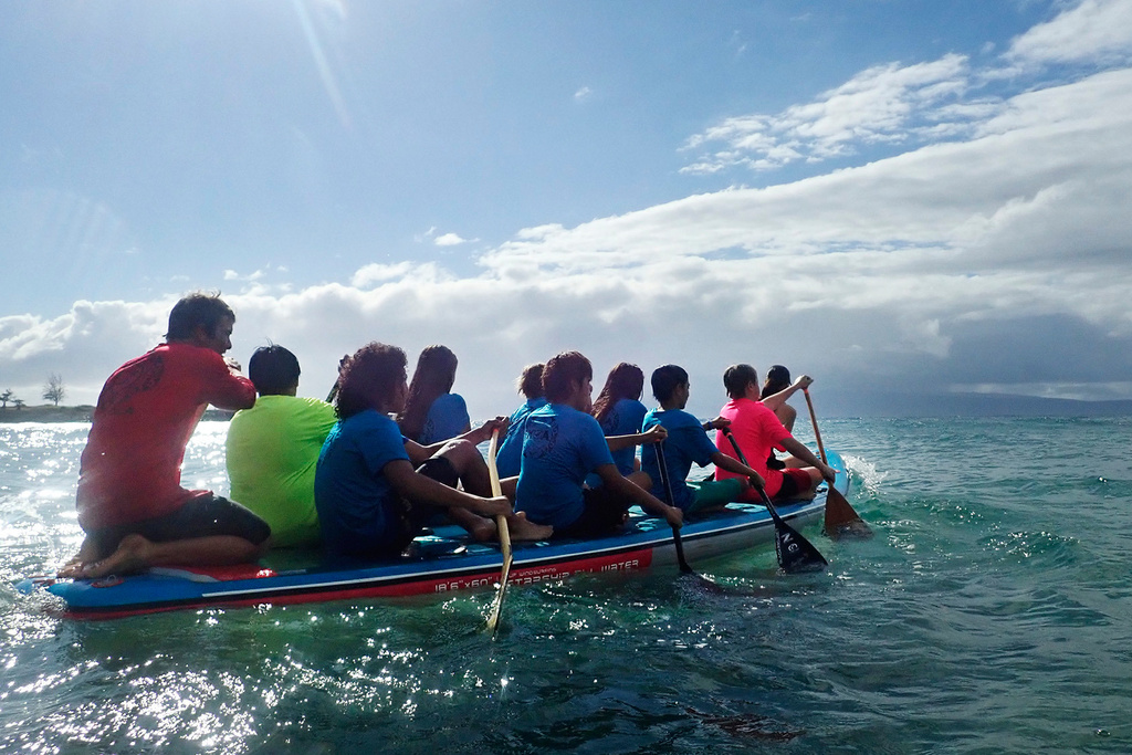 Kahākūahi Ocean Academy's Zane Kekoa Schweizer, left, steers as Maui Hero Project youth paddle into the bay from D.T. Fleming Beach in Lahaina, Hawaii, on Tuesday, June 10, 2025. (Kevin Fujii/Honolulu Civil Beat via AP)