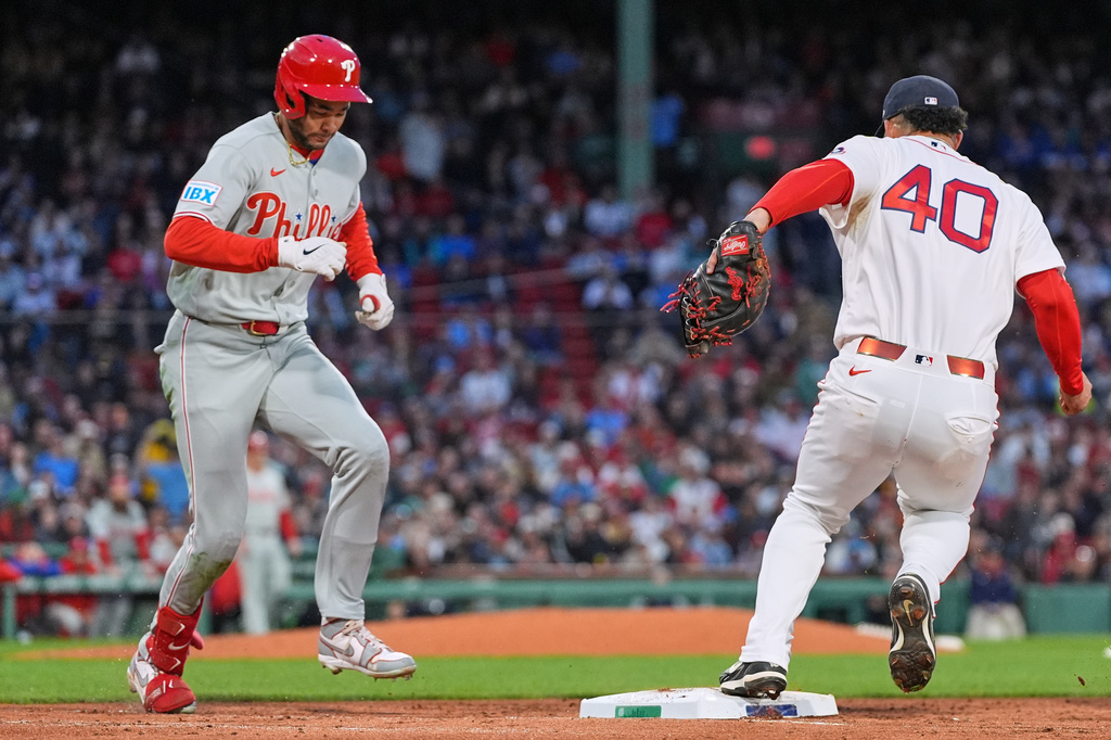 Boston Red Sox first baseman Willson Contreras (40) makes the force out, after making the play on a grounder by Philadelphia Phillies' Justin Crawford, left, during the fifth inning of a baseball game, Wednesday, May 13, 2026, in Boston. (AP Photo/Charles Krupa)