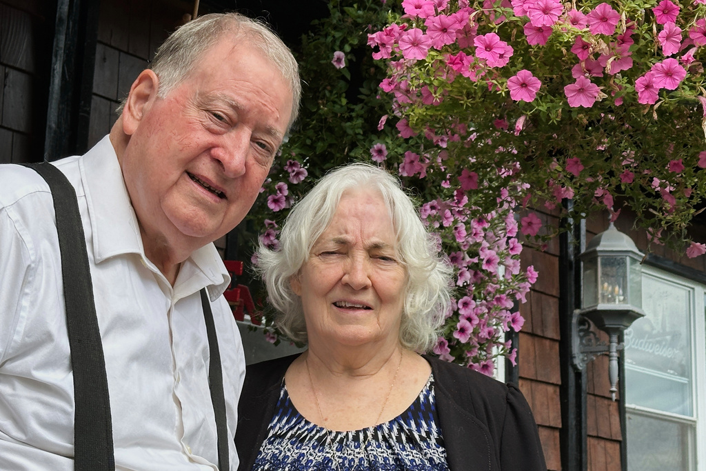 Gene and Christine Corrigan stand outside their restaurant, The Lake House Restaurant & Lodge, in Richfield Springs, N.Y., on Friday, July 18, 2025. (AP Photo/Michael Hill)