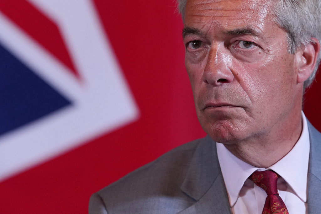 Nigel Farage, Leader of Britain's Reform UK party, speaks during a press conference in London, Monday, Aug. 10, 2026. (AP Photo/Kin Cheung)
