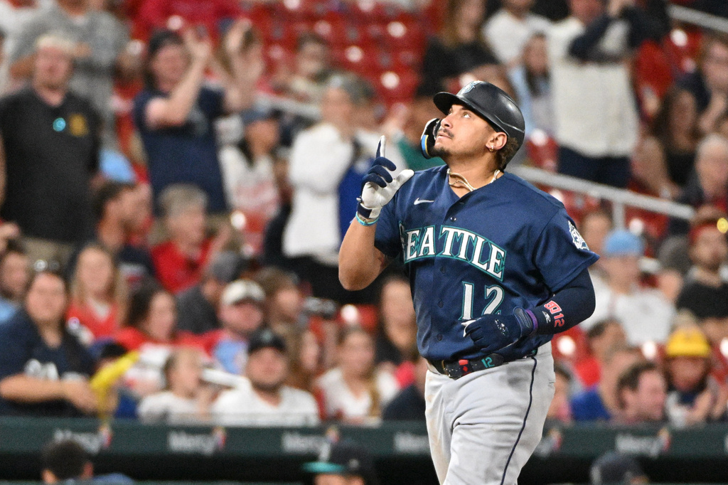 Seattle Mariners' Josh Naylor reacts after hitting a home run against the St. Louis Cardinals during the sixth inning of a baseball game, Friday, April 24, 2026, in St. Louis. (AP Photo/Jeff Le)