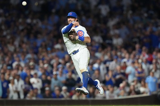 Chicago Cubs' Dansby Swanson makes a play on a ball hit by San Diego Padres' Luis Arraez during the eighth inning of Game 3 of a National League wild card baseball game Thursday, Oct. 2, 2025, in Chicago. (AP Photo/Nam Huh) Chicago Cubs' Dansby Swanson makes a play on a ball hit by San Diego Padres' Luis Arraez during the eighth inning of Game 3 of a National League wild card baseball game Thursday, Oct. 2, 2025, in Chicago. (AP Photo/Nam Huh)