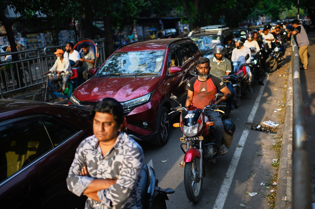 Motorists queue up outside a fuel pump in Dhaka, as Bangladesh tries to handle its energy crisis related to the Iran war, Sunday, April 5, 2026. (AP Photo/Mahmud Hossain Opu)