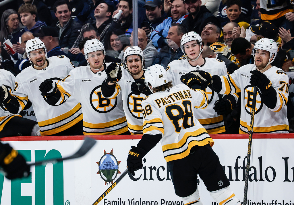 Boston Bruins' David Pastrnak (88) celebrates his goal against the Winnipeg Jets during first period NHL action in Winnipeg, Manitoba, on Thursday, Dec. 11, 2025. (John Woods/The Canadian Press via AP)