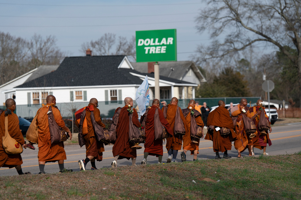 FILEW - Buddhist monks participate in the, "Walk For Peace," in Saluda, S.C., Jan. 8, 2026. (AP Photo/Allison Joyce)