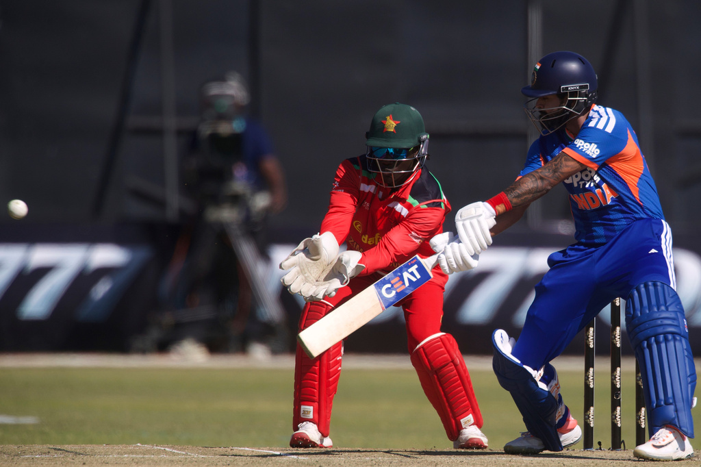 India's captain Shreyas Iyer, right, plays a shot as Zimbabwe's wicketkeeper Tadiwanashe Marumani during the third T20 cricket match between Zimbabwe and India in Harare, Zimbabwe, Sunday, July 26, 2026. (AP Photo/Wonder Mashura)