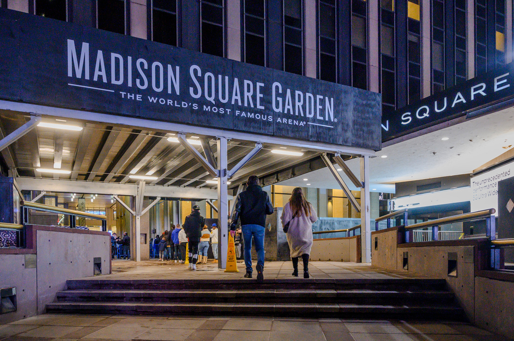 FILE - Fans line up outside Madison Square Garden before an NBA basketball game in New York, Feb. 23, 2021. (AP Photo/Brittainy Newman, File)
