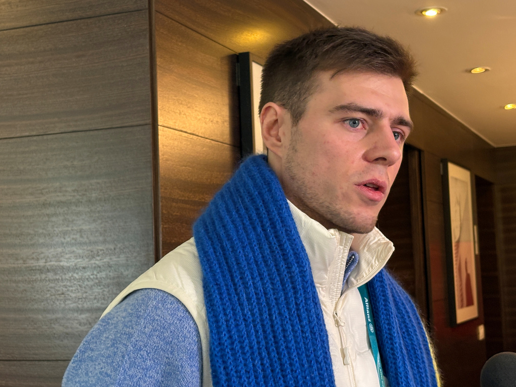 Ukrainian skeleton athlete Vladyslav Heraskevych speaks to the media amid an ongoing appeal hearing in Milan, Italy, Friday, Feb. 13, 2026. (AP Photo/Stefanie Dazio)