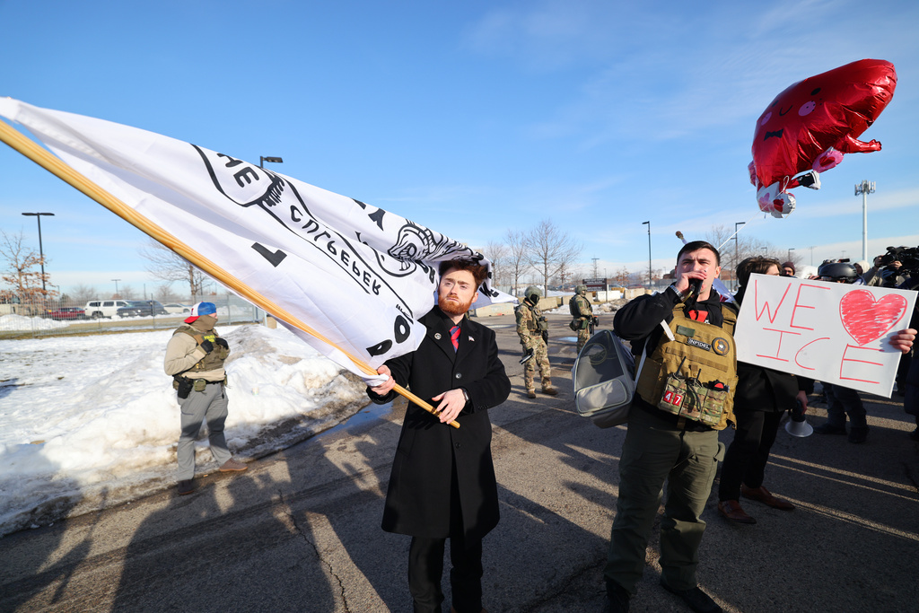 Supporters of United States Immigration and Customs Enforcement rally outside the Bishop Henry Whipple Federal Building in Minneapolis, Friday, Jan. 9, 2026. (AP Photo/Adam Bettcher)