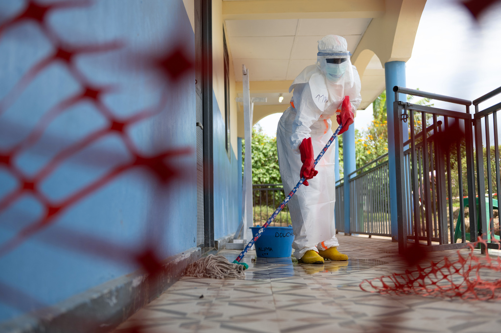 A health worker mops the floor at the Ebola treatment center in Rwampara, Congo, Friday, May 29, 2026. (AP Photo/Moses Sawasawa)