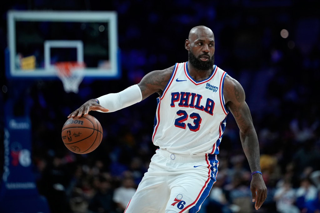 Philadelphia 76ers' LeBron James dribbles during the second half of a preseason NBA basketball game against the Boston Celtics Friday, Oct. 16, 2026, in Philadelphia. (AP Photo/Matt Slocum)