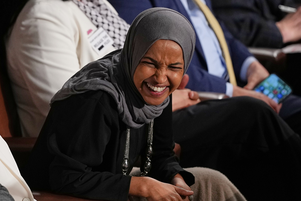 Rep. Ilhan Omar, D-Minn., listens as President Donald Trump delivers the State of the Union address to a joint session of Congress in the House chamber at the U.S. Capitol in Washington, Tuesday, Feb. 24, 2026. (AP Photo/Matt Rourke)