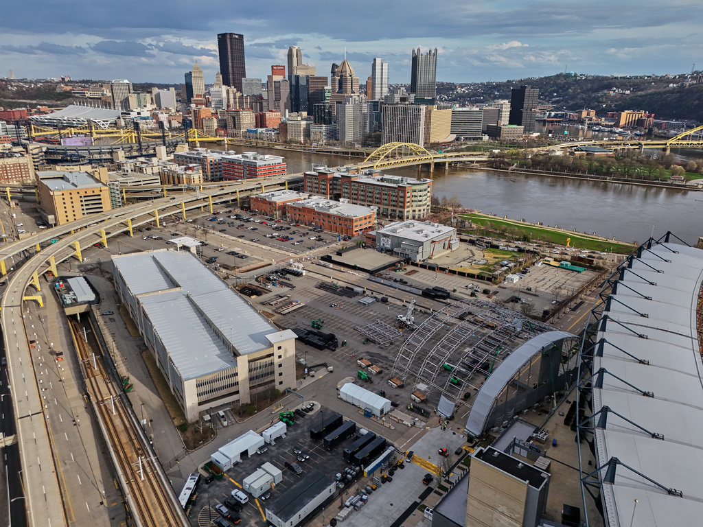 The stage for the upcoming 2026 NFL Football Draft is under construction in a parking lot adjacent to Acrisure Stadium, right, Thursday, April 2, 2026, on Pittsburgh's Northside. The NFL Draft will be held in Pittsburgh, April 23-25. (AP Photo/Gene J. Puskar)