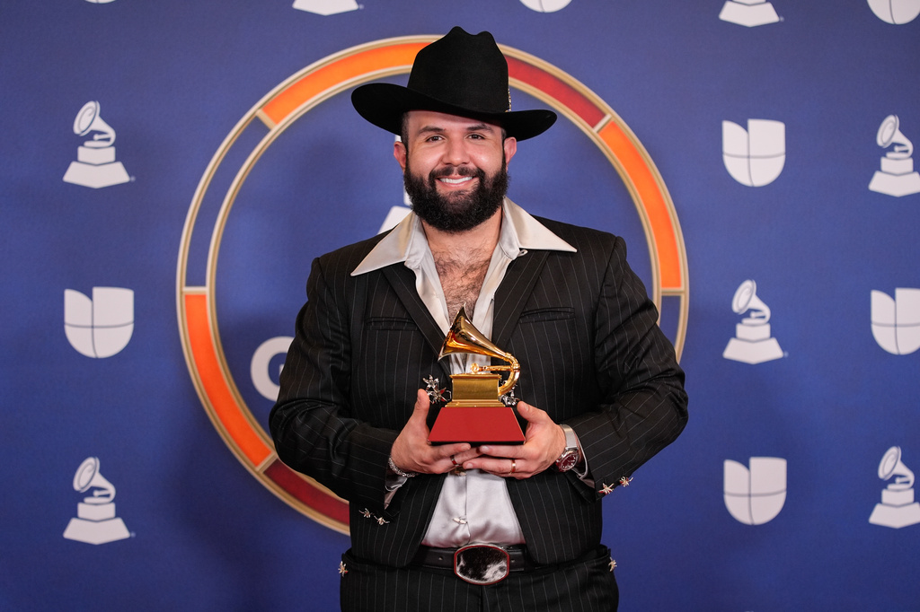 FILE - Carín León, winner of the award for best contemporary mexian music album for "Palabra De To's," poses in the press room during the 2025 Latin Grammys on Thursday, Nov. 13, 2025, at MGM Grand in Las Vegas. (AP Photo/John Locher, File)