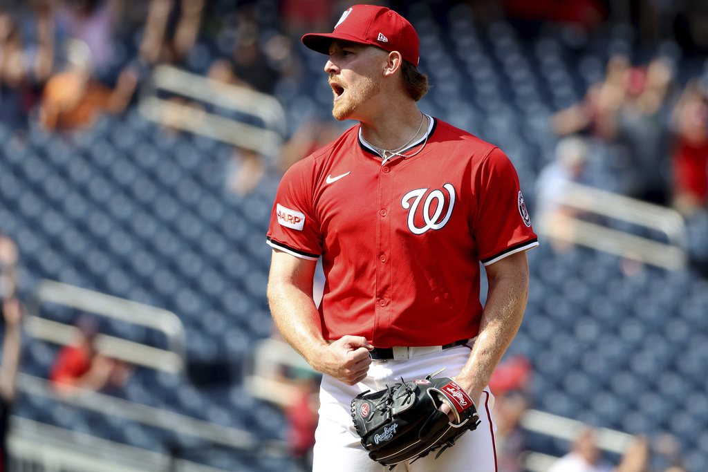 Washington Nationals pitcher Clayton Beeter celebrates after a baseball game against the Pittsburgh Pirates, Sunday, Sept. 14, 2025, in Washington. (AP Photo/Daniel Kucin Jr.)