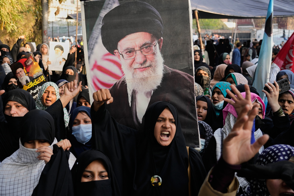Shiite Muslims chant anti U.S slogans during a rally to condemn the killing of Iranian Supreme Leader Ayatollah Ali Khamenei, in Lahore, Pakistan, Sunday, March 1, 2026. (AP Photo/K.M. Chaudary)