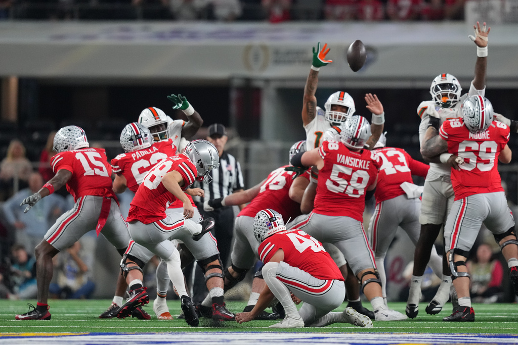 Ohio State kicker Jayden Fielding, with Joe McGuire holding, misses a field goal against Miami during the first half of the Cotton Bowl College Football Playoff quarterfinal game Wednesday, Dec. 31, 2025, in Arlington, Texas. (AP Photo/Julio Cortez)