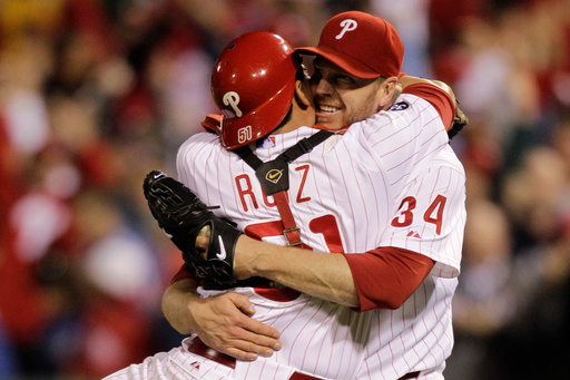 FILE - In this Oct. 6, 2010, file photo, Philadelphia Phillies starting pitcher Roy Halladay celebrates with catcher Carlos Ruiz (51) after throwing a no-hitter to defeat the Cincinnati Reds in Game 1 of baseball's National League Division Series in Philadelphia. (AP Photo/Rob Carr, File) FILE - In this Oct. 6, 2010, file photo, Philadelphia Phillies starting pitcher Roy Halladay celebrates with catcher Carlos Ruiz (51) after throwing a no-hitter to defeat the Cincinnati Reds in Game 1 of baseball's National League Division Series in Philadelphia. (AP Photo/Rob Carr, File)